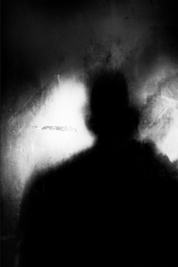 silhouette of man in black and white 