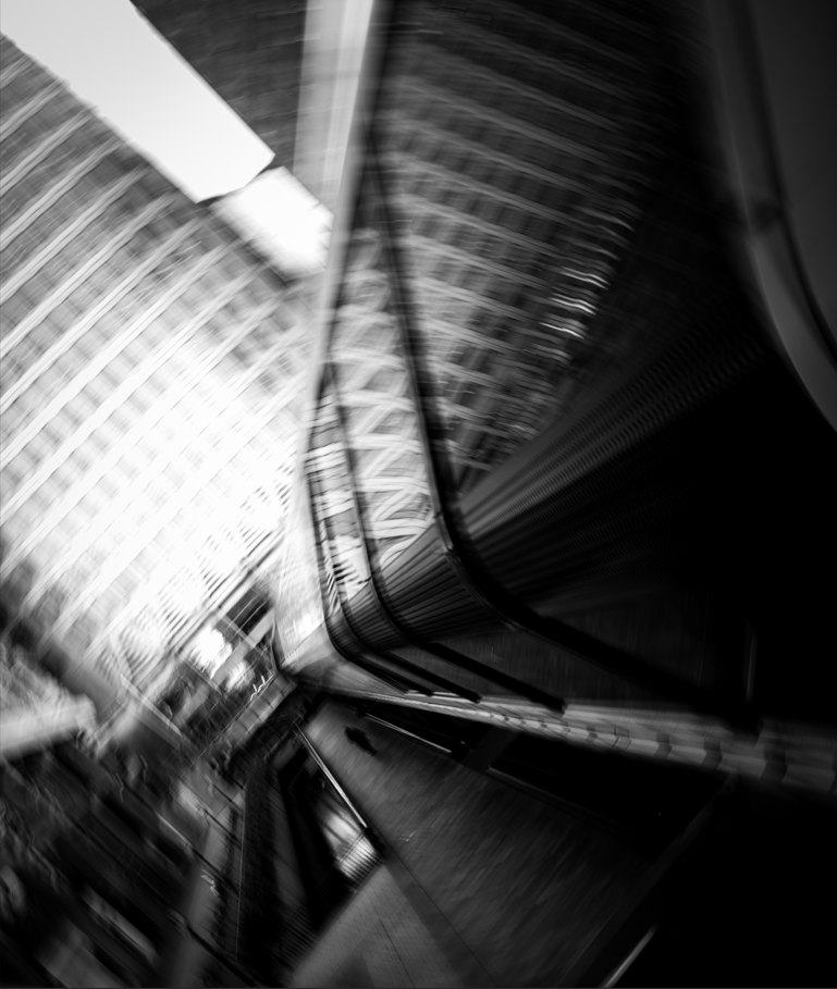 black and white blurred image of windows